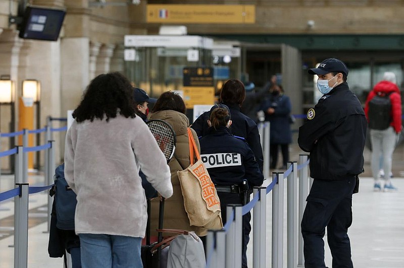 People in Paris board the first train heading to England on Friday, the first day after Britain officially left the European Union’s single market for people, goods and services. More photos at arkansasonline.com/12brexit/.
(AP/Thibault Camus)