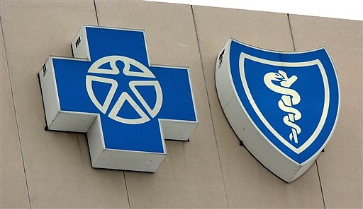 The Blue Cross and Blue Shield logos are shown in this February 2008 file photo.