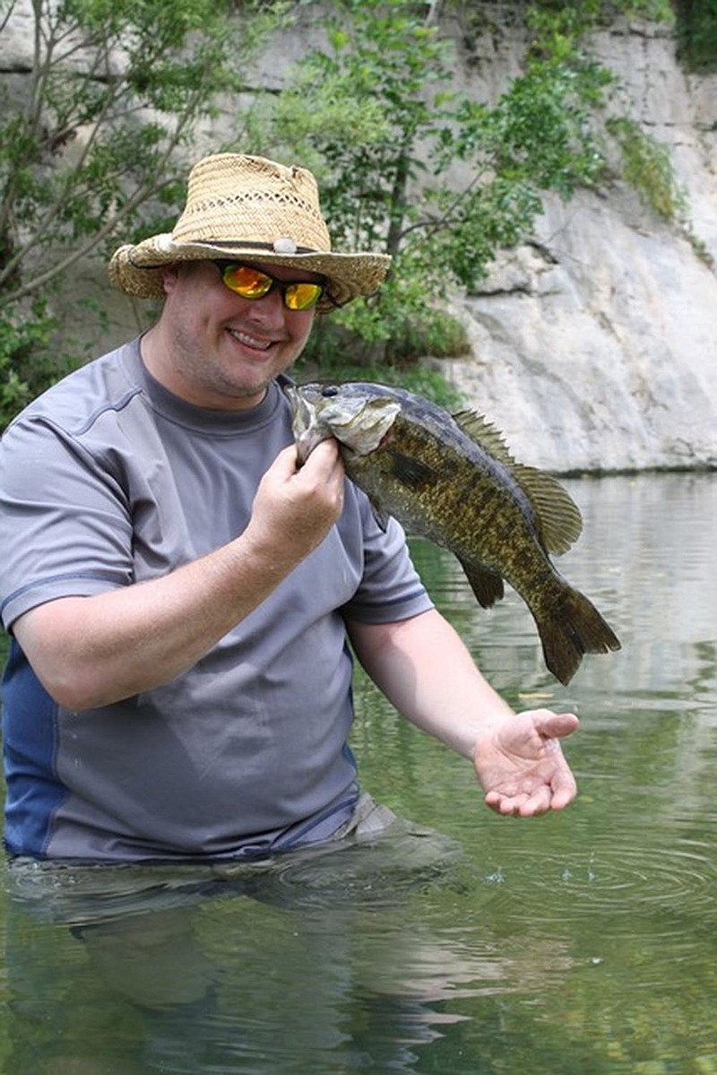 Smallmouth bass fishing is phe- nomenal in the state in spring, summer and fall. The best way to enjoy it is wade shing on an Ozark highland stream. (Arkansas Democrat-Gazette/ Bryan Hendricks) 