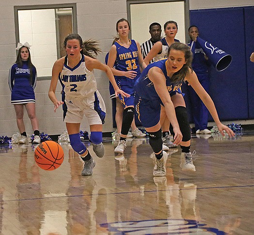 Siandhara Bonnet/News-Times In this file photo, Parkers Chapel’s Macie Wood chases after a loose ball during the Lady Trojans’ contest against Spring Hill during the 2019-20 season. The schools will meet tonight at Parkers Chapel.