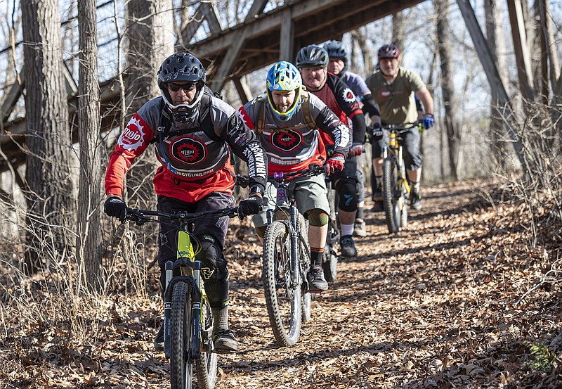 The Team Low T riders are from left to right, Dave Neal, Chuck Young, Stephen Byrne, Randy Johnson, Rusty Cramer ride Wednesday on Coler Preserve in Bentonville. (NWA Democrat-Gazette/Spencer Tirey)
