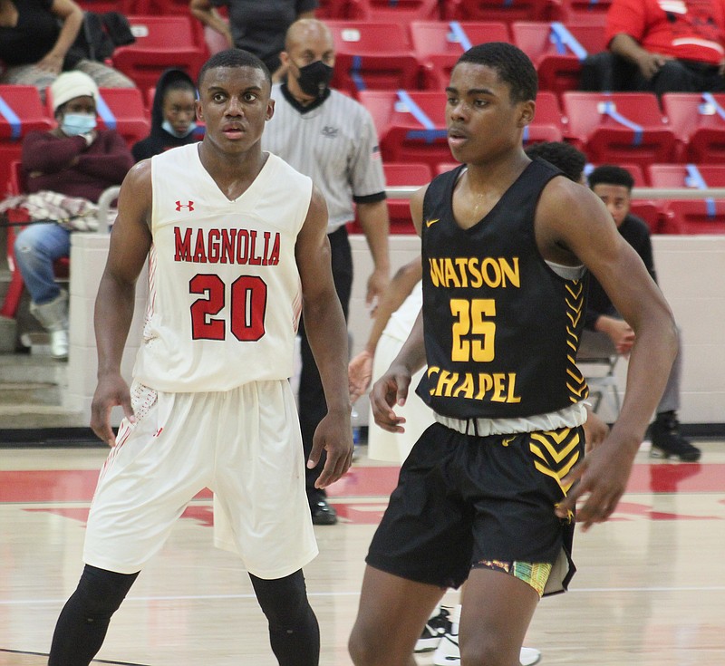 Magnolia’s Derrian Ford (20), who finished with a game-high 27 points, guards Watson Chapel’s Khamani Cooper during Tuesday action at Panther Arena. The Panthers won 58-47 and will host Crossett Friday night.