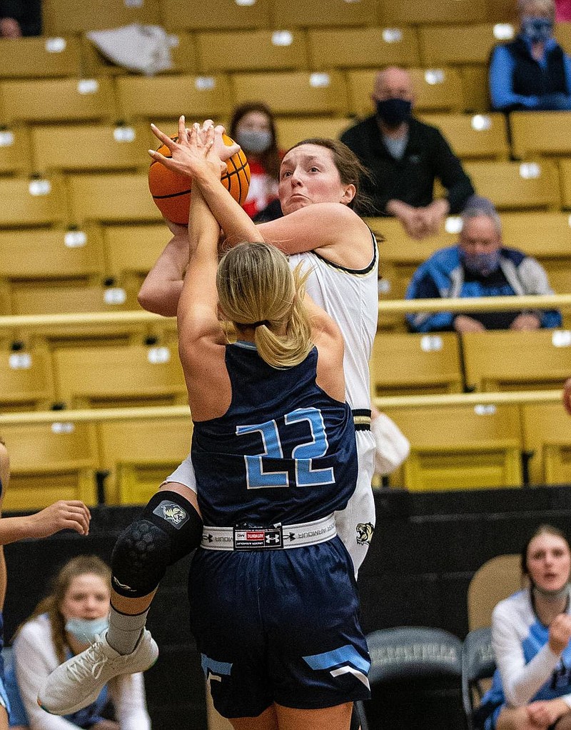  Gracie Eaves (10) of Bentonville get fouled by Ella Nelson (22) of Spring Har-ber at Tiger Arena, Bentonville, AR January 5, 2021 / Special to NWA Democrat-Gazette/ David Beach
