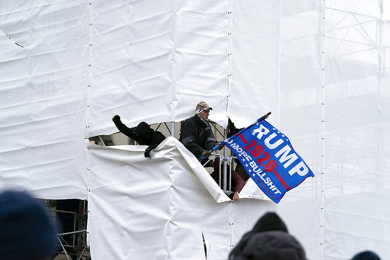 Trump supporters gather outside the Capitol, Wednesday, Jan. 6, 2021, in Washington. As Congress prepares to affirm President-elect Joe Biden's victory, thousands of people have gathered to show their support for President Donald Trump and his claims of election fraud. (AP Photo/Jose Luis Magana)