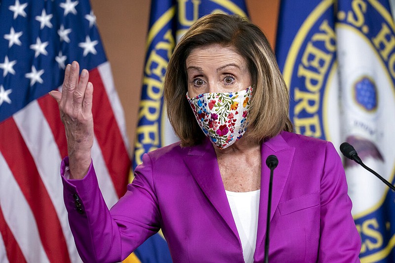 Speaker of the House Nancy Pelosi, D-Calif., holds a news conference on the day after violent protesters loyal to President Donald Trump stormed the U.S. Congress, at the Capitol in Washington, Thursday, Jan. 7, 2021. (AP Photo/J. Scott Applewhite)

