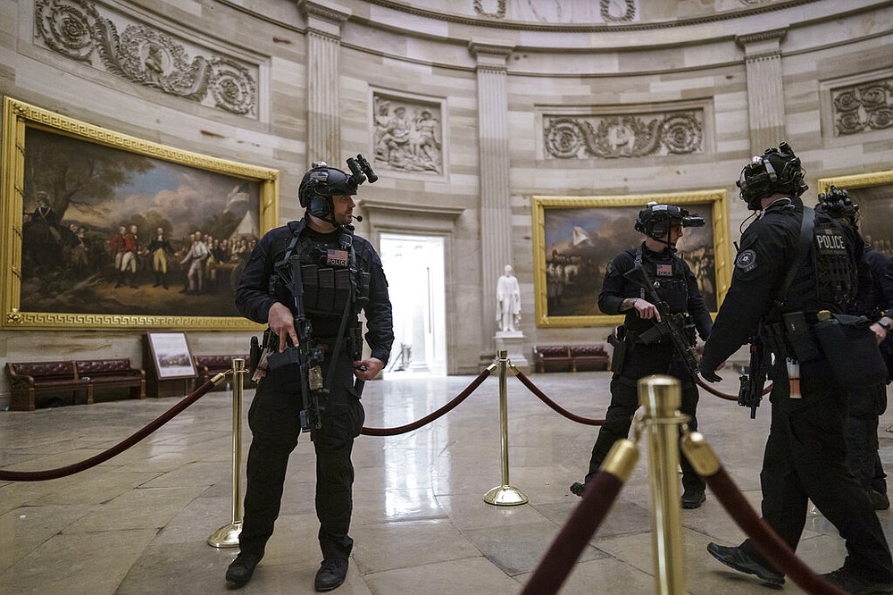 Members of the U.S. Secret Service Counter Assault Team walk through the Rotunda as they and other federal police forces responded as violent protesters loyal to President Donald Trump stormed the U.S. Capitol today, at the Capitol in Washington, Wednesday, Jan. 6, 2021.