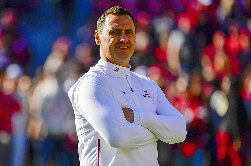 In this Nov. 9, 2019, file photo, Alabama offensive coordinator Steve Sarkisian watches warmups before an NCAA football game against LSU in Tuscaloosa, Ala. Texas has hired Sarkisian as the Longhorns new coach. The move comes just a few hours after Texas announced the firing of Tom Herman after four seasons with no Big 12 championships. (AP Photo/Vasha Hunt, File)