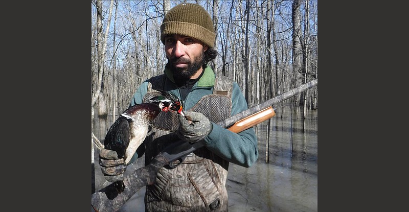 Basel Khalil of North Little Rock displays a colorful wood duck he shot at the Bayou Meto Wildlife Management Area in 2016.
(Arkansas Democrat-Gazette/Bryan Hendricks)