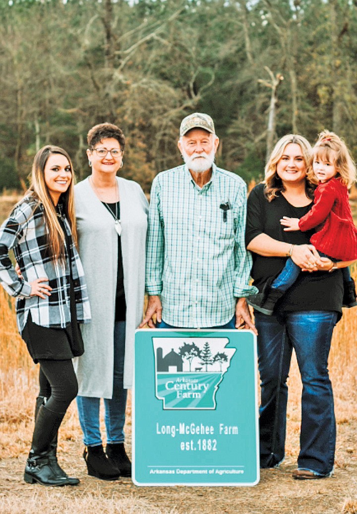The Long-McGehee farm is one of 30 farms recognized in the 2020 Arkansas Century Farm program. Windle Long, center, is shown with, from left, his granddaughter Shelby McGehee; his daughter, Susan Long McGehee; and his granddaughter Jessica Mashburn, holding his great-granddaughter, Linleigh Mashburn.