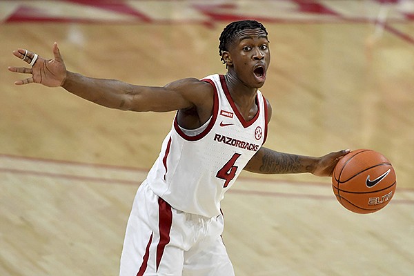 Arkansas guard Davonte Davis (4) runs a play against Georgia during the second half of an NCAA college basketball game Saturday, Jan. 9, 2021, in Fayetteville. (AP Photo/Michael Woods)


