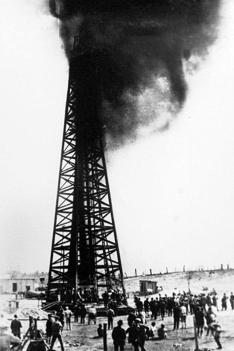An oil well blows on Jan. 10, 1921, near El Dorado. The discovery of oil in south Arkansas created boomtowns in the 1920s. (AP/Arkansas History Commission) 