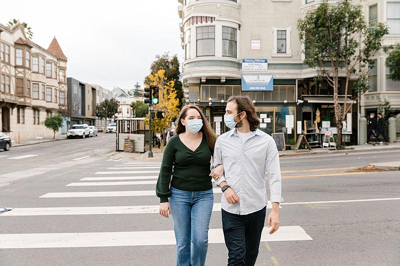 Joanna Illing (left) and Stephen Miller became engaged during the pandemic after isolation together went better than expected. To propose to Illing, Miller had their neighbor’s 11-year-old Maltipoo trot into their apartment with the ring in a bag around its neck.
(For The Washington Post/Jason Henry)