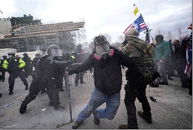 Trump supporters try to break through a police barrier, Wednesday, Jan. 6, 2021, at the Capitol in Washington. As Congress prepares to affirm Presidentelect Joe Biden’s victory, thousands of people have gathered to show their support for President Donald Trump and his claims of election fraud.
