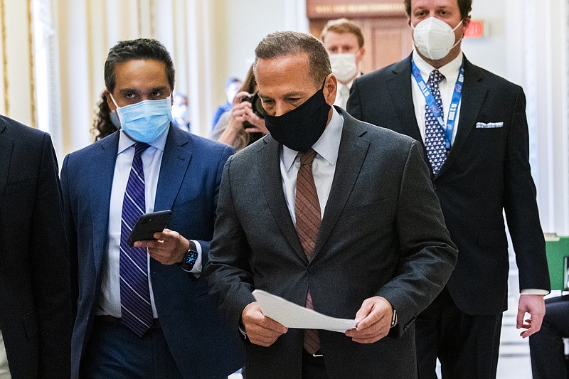 Rep. David Cicilline, D-R.I., is followed by reporters as he walks outside the House Chamber at the Capitol, Monday, Jan. 11, 2021, in Washington.