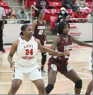 Senior Lady Panther Qua’najah (24) protects the lane during action against Crossett Friday night. Magnolia won 44-34 and will play at home Wednesday against Warren.