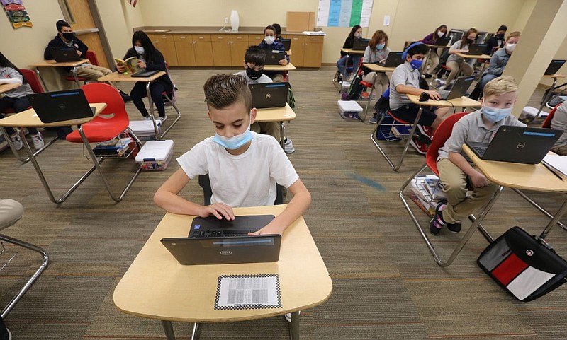 Thomas Taylor, a sixth grade student, studies after taking at test at LISA Academy in Springdale in this Oct. 29, 2020, file photo.