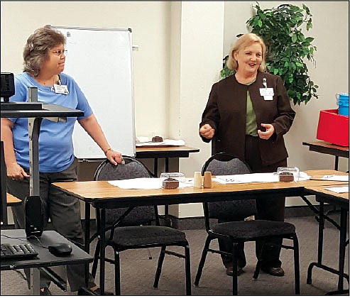 At left, Chemical Dependency unit director Teresa Roark and, right, OCMC CEO Peggy Abbott give a talk at A Healthy Ouachita County on addiction. story.lead_photo.caption