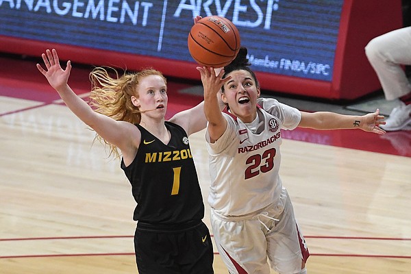 Arkansas’ Amber Ramirez shoots in front of Missouri’s Lauren Hansen Sunday Jan. 3, 2021 at Bud Walton Arena in Fayetteville. Arkansas won 91-88.
