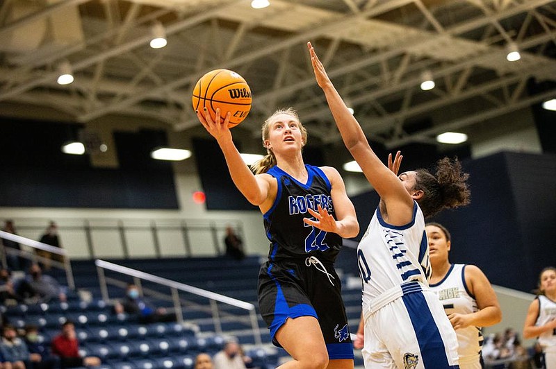 Kate Miller (22) of Rogers goes up for layup against Ivy Johnson (0) of Bentonville West at Wolverine Arena, Centerton,  AR, Tuesday, January 12, 2021 / Special to NWA Democrat-Gazette/ David Beach