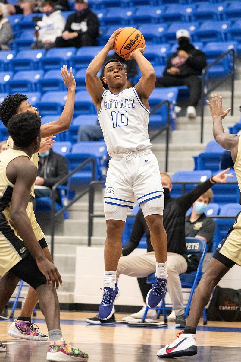 Bryant’s point guard Camren Hunter (center) takes a shot during their game against Little Rock Central Friday night at Bryant Arena. (Arkansas Democrat-Gazette/Justin Cunningham)