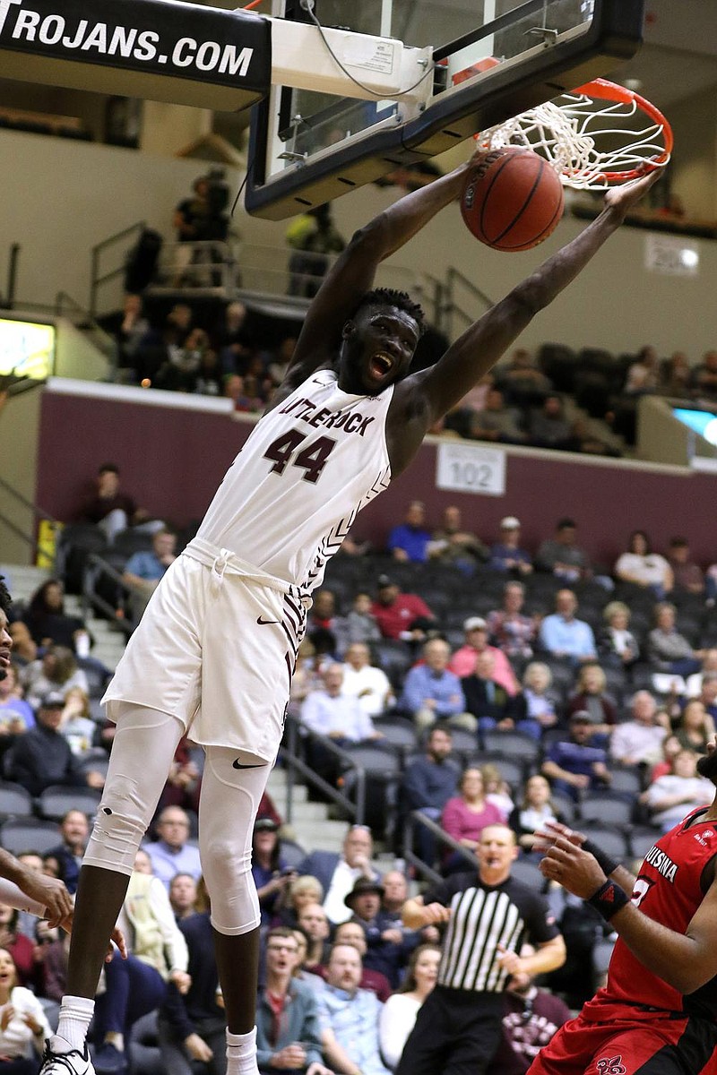 UALR's Ruot Monyyong (44) dunks the ball during the first half of the Trojans' 91-69 win on Saturday, Feb. 29, 2020, at the Jack Stephens Center in Little Rock. 
See more photos at www.arkansasonline.com/31ualrbball/
(Arkansas Democrat-Gazette/Thomas Metthe)