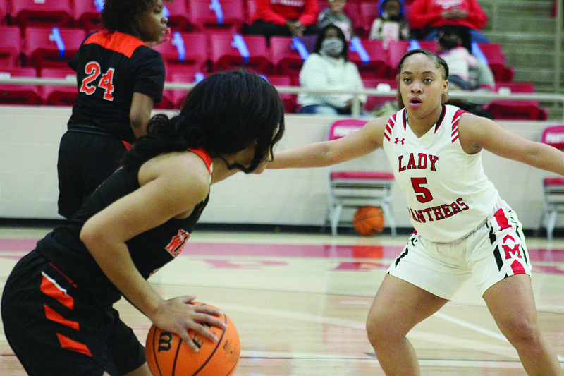 Sophomore Janiyah Glover plays defense during Wednesday’s win over Warren. Magnolia plays at Star City tonight. Tip-off is set for 6 p.m.