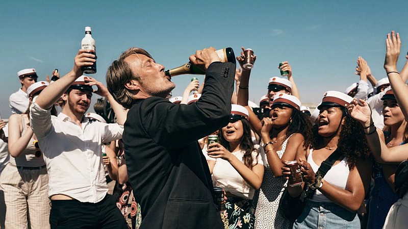 Mads Mikkelsen plays a history teacher who experiments with drinking to improve his performance in the classroom in Thomas Vinterberg’s “Another Round.” (Special to the Democrat-Gazette/Samuel Goldwyn Films)