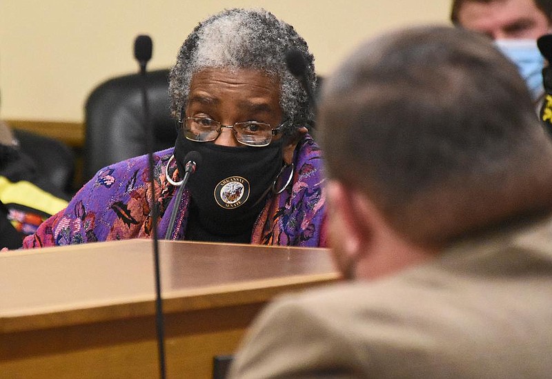 Sen. Stephanie Flowers, D-Pine Bluff, speaks to Sen. Bob Ballinger, R-Ozark, while testifying Wednesday in a Senate Judiciary Committee hearing against Senate Bill 24, which Ballinger sponsored. Flowers said current state laws adequately allow people to use deadly force in self-defense. “It seems that we are encouraging people not to avoid confrontations when it can be successfully done,” she said. More photos at arkansasonline.com/114sb24/.
(Arkansas Democrat-Gazette/Staci Vandagriff)