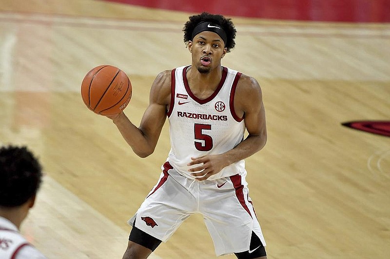 Arkansas guard Moses Moody (5) passes the ball during a game against Georgia on Jan. 9, 2021, in Bud Walton Arena in Fayetteville.