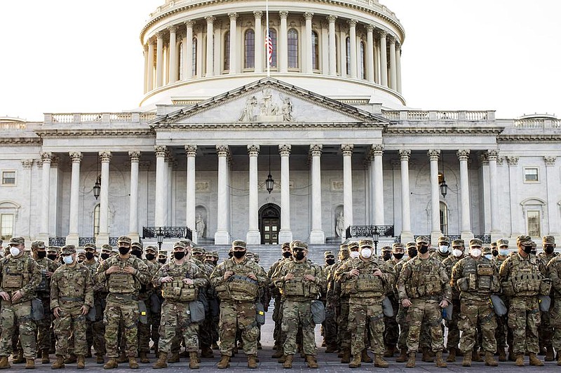 National Guard troops, part of a large security force, muster Thursday outside the U.S. Capitol.
(The New York Times/Jason Andrew)