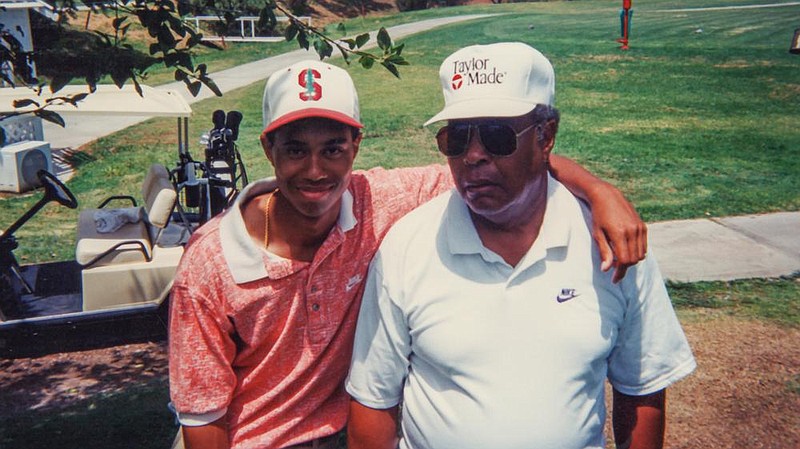 The young Tiger Woods and his father, Earl, circa 1995, are seen in a photo used in part one of the HBO documentary “Tiger.”