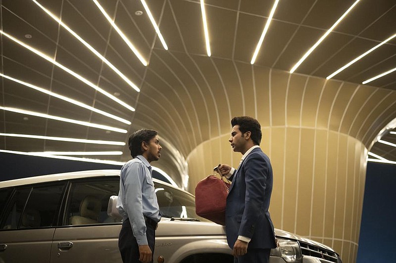 Low caste driver Balram (Adarsh Gourav) sees it as his duty and destiny to be a faithful servant to his boss’ son, the Western-educated Ashok (Rajkummar Rao) in Ramin Bahrani’s powerful “The White Tiger.”