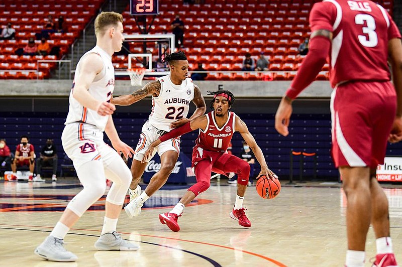 Arkansas senior guard Jalen Tate (11) dribbles into the front court during the Razorbacks’ victory at Auburn on Dec. 30. Heading into their game today at Alabama, the Razorbacks are one of 10 SEC teams to earn road victories in conference play this season.
(Photo courtesy of the SEC)