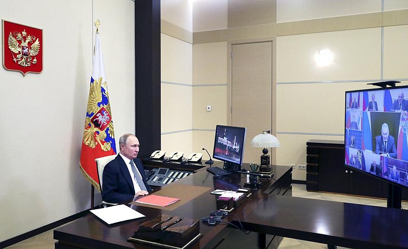 Russian President Vladimir Putin leads a videoconferenced security council meeting Friday at a residence outside Moscow. Russia’s Foreign Ministry said the U.S. exit from the Open Skies Treaty “significantly upended the balance of interests of signatory states.”
(AP/Kremlin pool/Mikhail Klimentyev)