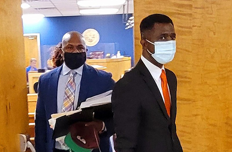 Saracen Cinema 8 Theater owners Steven Mays Jr. (left) and Okorie Ezieme of Rain Investments LLC exit circuit court Friday morning after Circuit Judge Rob Wyatt Jr. made a ruling to grant part of their motion for summary judgment. 
(Pine Bluff Commercial/Eplunus Colvin)