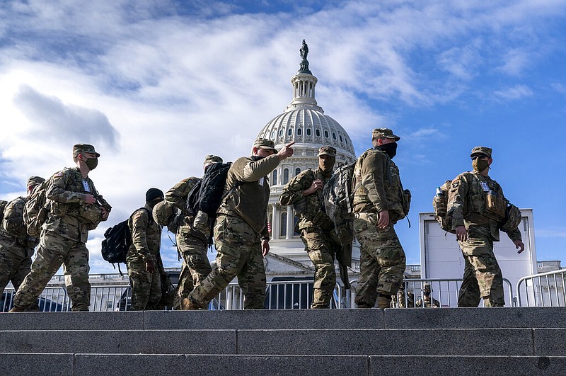 National Guard troops reinforce security around the U.S. Capitol in Washington on Sunday, Jan. 17, 2021, ahead of the inauguration of President-elect Joe Biden and Vice President-elect Kamala Harris.