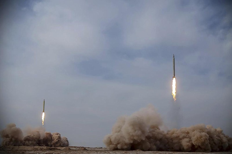 Iran launches missiles at “hypothetical hostile enemy ships” 1,120 miles away, state television reported Saturday.
(AP/Sepahnews/Iranian Revolutionary Guard)