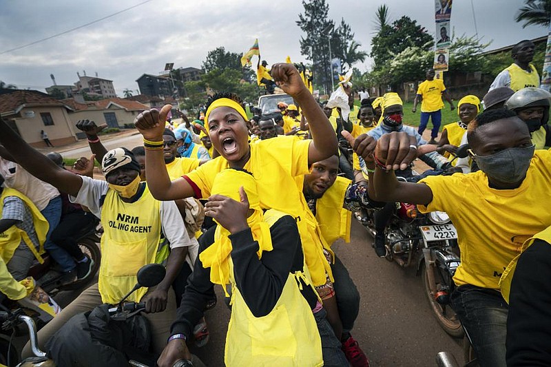Supporters of Ugandan President Yoweri Museveni celebrate Saturday in Kampala after he was declared the winner of a sixth term in office.
(AP/Jerome Delay)