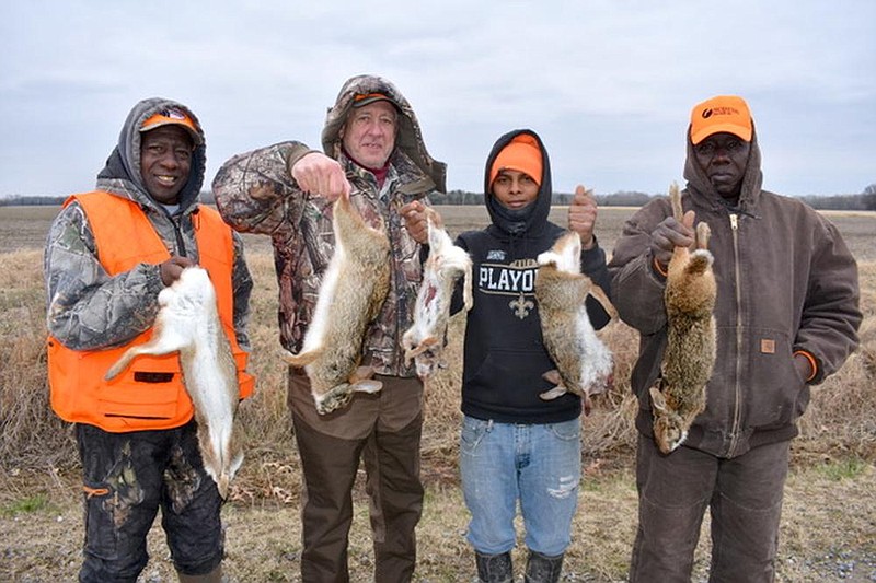 Prairie County produced an exciting rabbit hunt Jan. 9 for (from left) Hollis Foster of Holly Grove, Bob Rogers of Maumelle, Tony Booth of Holly Grove and Steve Lowery of Holly Grove.
(Arkansas Democrat-Gazette/Bryan Hendricks)