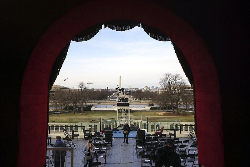 A view from the lower west terrace door as preparations are made prior to a dress rehearsal for the 59th inaugural ceremony for President-elect Joe Biden and Vice President-elect Kamala Harris on Monday, January 18, 2021 at the U.S. Capitol in Washington. (Win McNamee/Pool via AP)