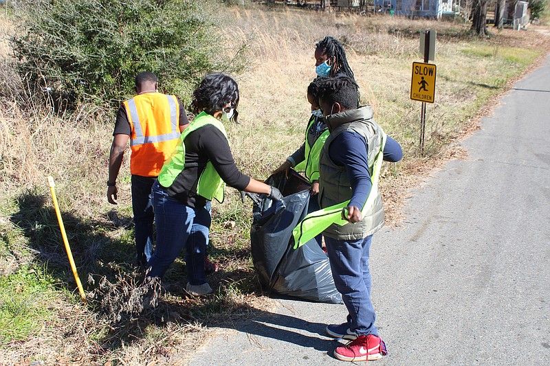 Students with the YAS (Young Artists Studio) participated in the MLK Day Community Clean-up, picking up roadside trash around Mattocks Park in El Dorado. (Matt Hutcheson/News-Times)