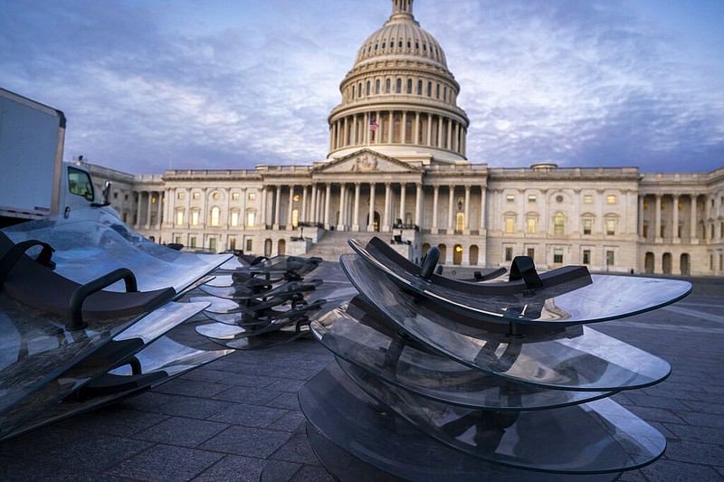 Riot shields are stacked at the ready as National Guard troops reinforce the security zone on Capitol Hill in Washington, Tuesday, Jan. 19, 2021, before President-elect Joe Biden is sworn in as the 46th president on Wednesday.