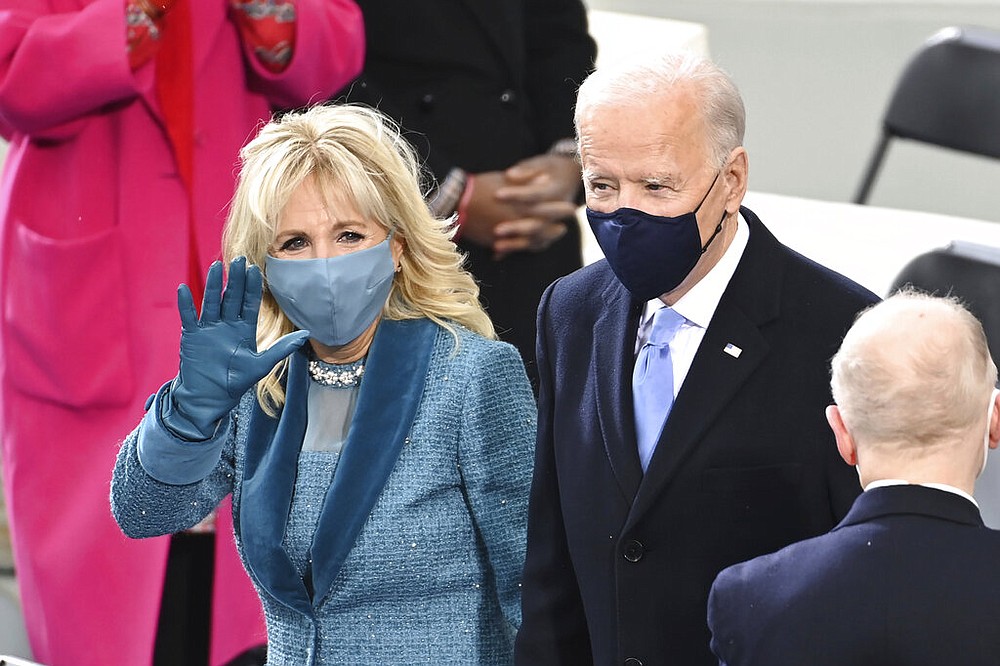 President-elect Joe Biden and his wife Jill Biden arrive for the 59th Presidential Inauguration at the U.S. Capitol for Biden in Washington, Wednesday, Jan. 20, 2021. (Saul Loeb/Pool Photo via AP)