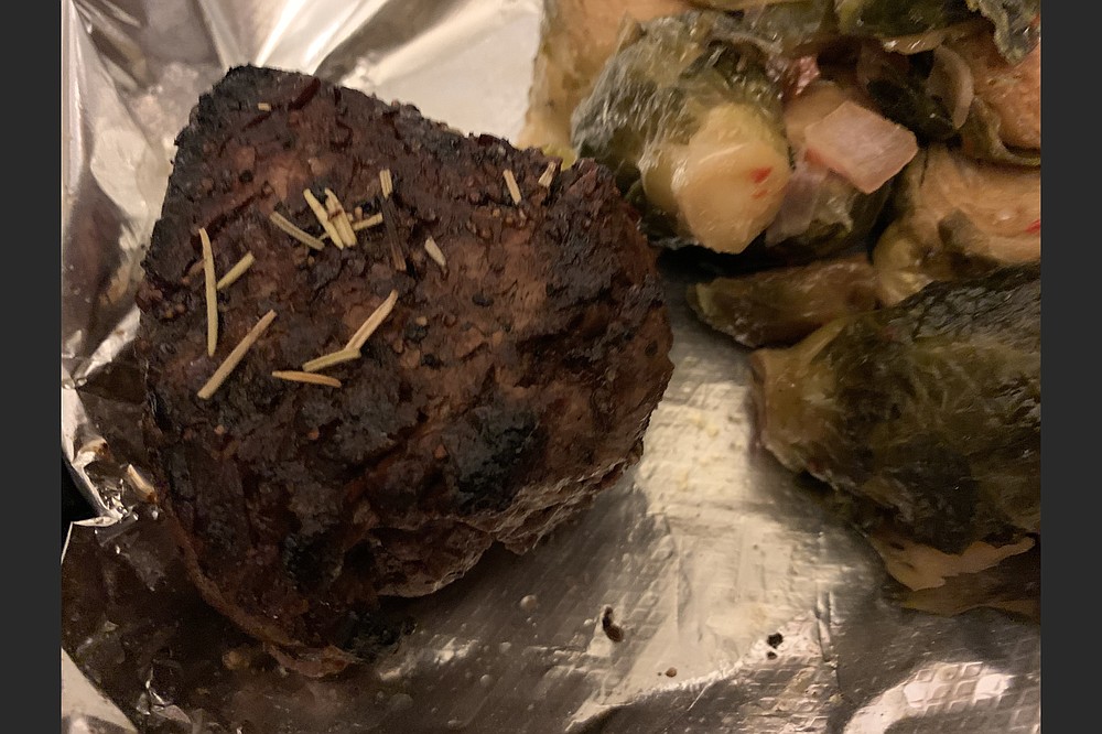 Bone’s Chophouse's 6-ounce center cut filet, with brussels sprouts on the side, was just as good for a take-out order as it was in the restaurant. (Arkansas Democrat-Gazette/Eric E. Harrison)