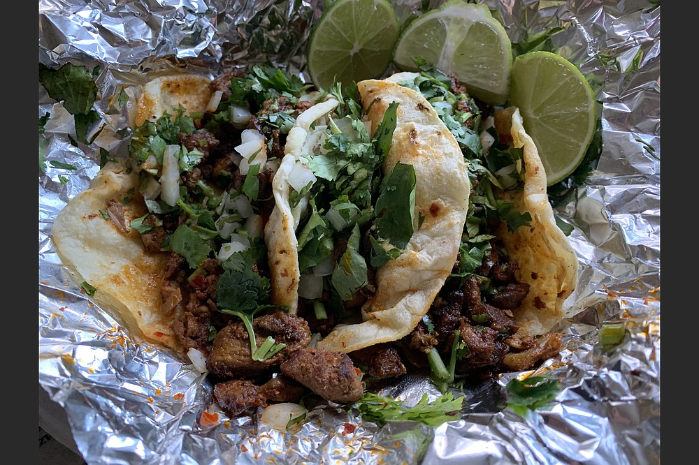 Three tacos al pastor made for a tasty Tuesday treat from Taqueria y Carniceria Guadalajara in North Little Rock. (Arkansas Democrat-Gazette/Eric E. Harrison)