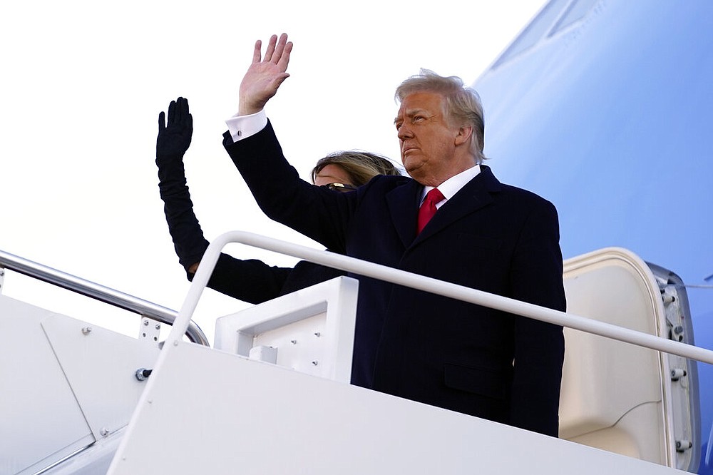 President Donald Trump and first lady Melania Trump board Air Force One at Andrews Air Force Base, Md., Wednesday, Jan. 20, 2021.
