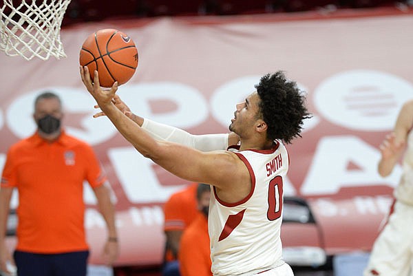 Arkansas forward Justin Smith goes for a layup during a game against Auburn on Wednesday, Jan. 20, 2021, in Fayetteville. 