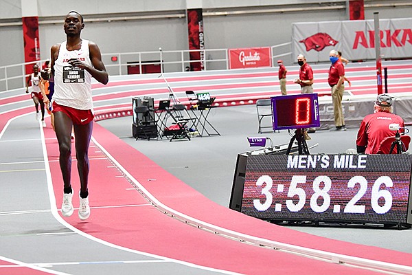 Arkansas' Amon Kemboi crosses the finish line during the mile run Friday, Jan. 22, 2021, in Fayetteville. 