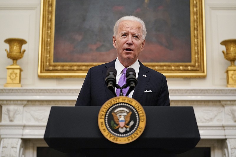 President Joe Biden speaks about the coronavirus in the State Dinning Room of the White House, Thursday, Jan. 21, 2021, in Washington. (AP Photo/Alex Brandon)