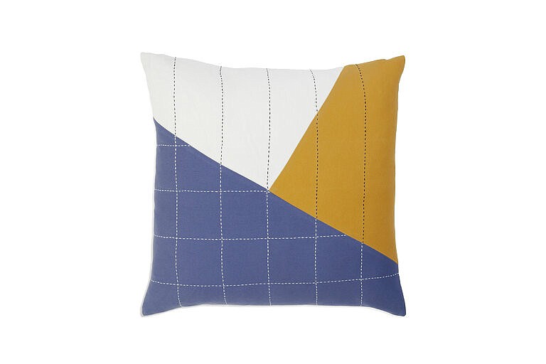 This image provided by Brooklinen shows a Anchal pillow. Artist, Colleen Clines, went to India while attending the Rhode Island School of Design; working with textiles with women there inspired her to found the non-profit Anchal Project with her sister Maggie. They now employ over 150 artisans in India as well as in their native Louisville, Kentucky. (Brooklinen via AP)